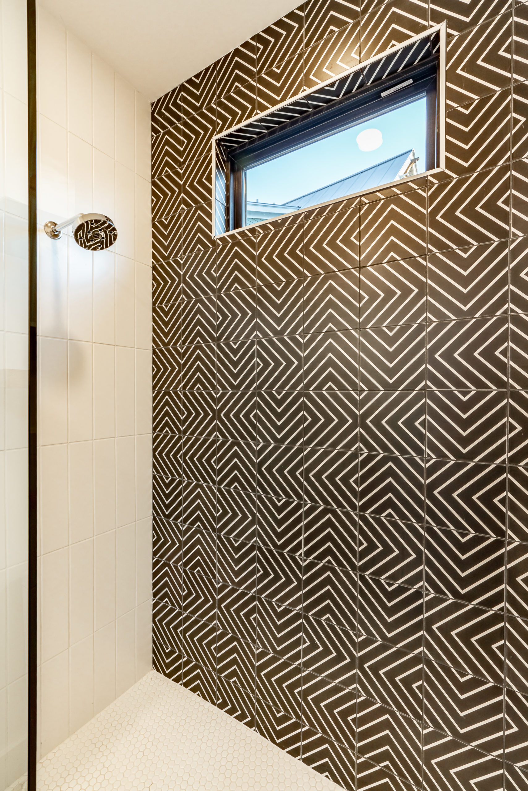 Woodview Custom guest bathroom featuring designer tile and plumbing