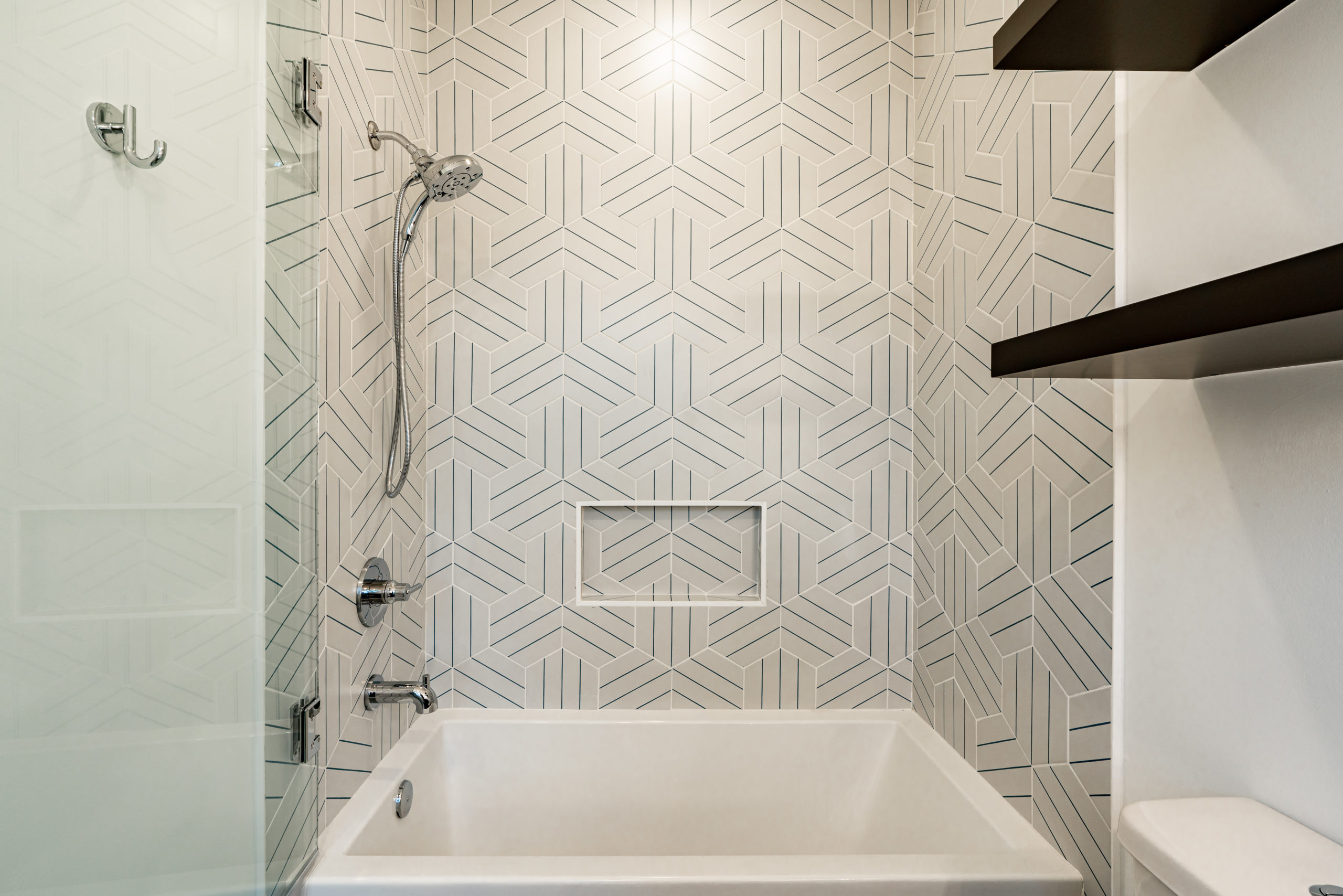 Woodview Custom secondary bath with designer tile and plumbing