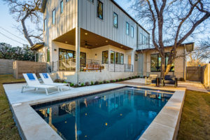 Pool and outdoor entertainment living area at Zilker, Austin custom home