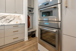 Luxury Thermador oven and microwave combo and mud room at Zilker custom home