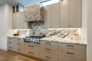 Luxury marble Calacatta Arabescato countertops with Thermador gas range at Zilker custom home