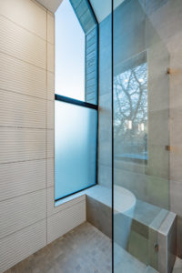 Custom made window for the walk in shower at 2007 De Verne custom home