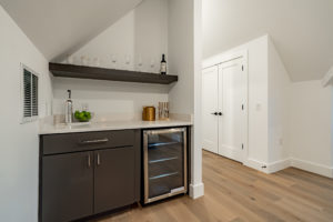 Third floor dry bar with beverage center at Zilker custom home